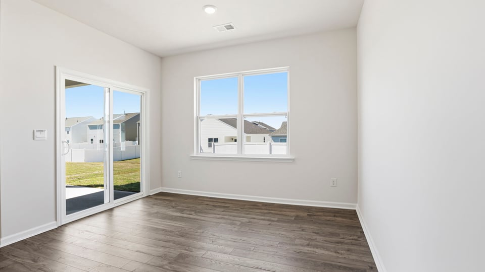 Dining room with window and siding doors.