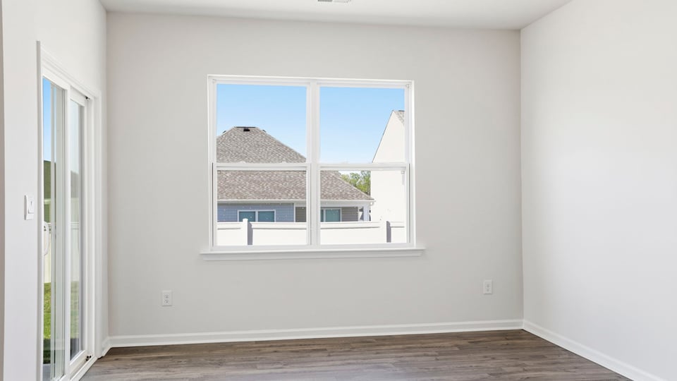 Dining room with window and siding doors.