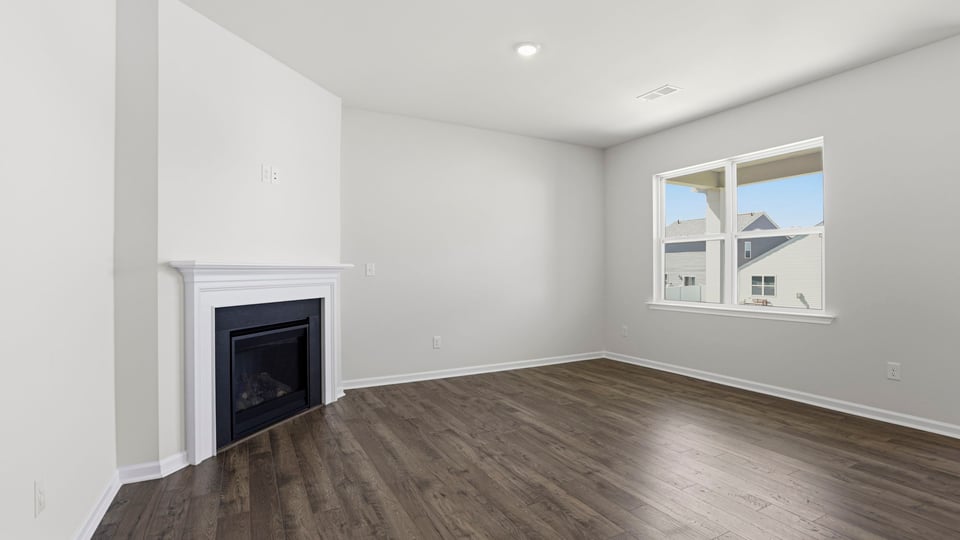 Livingroom with fireplace with window.