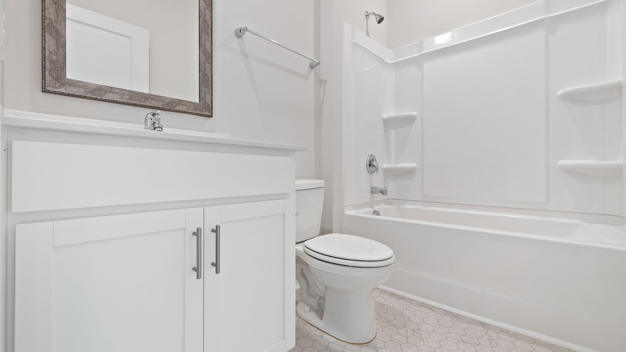 Bathroom with vanity and tub.