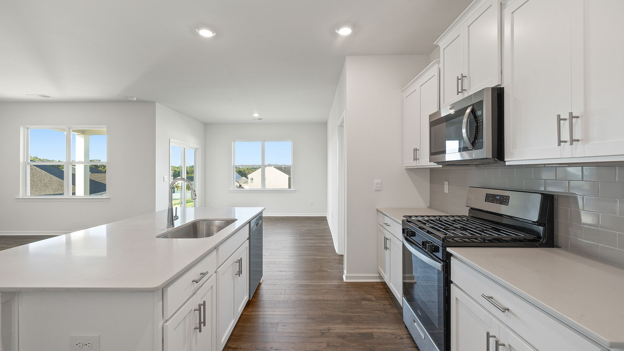 Kitchen and island with granite countertops.