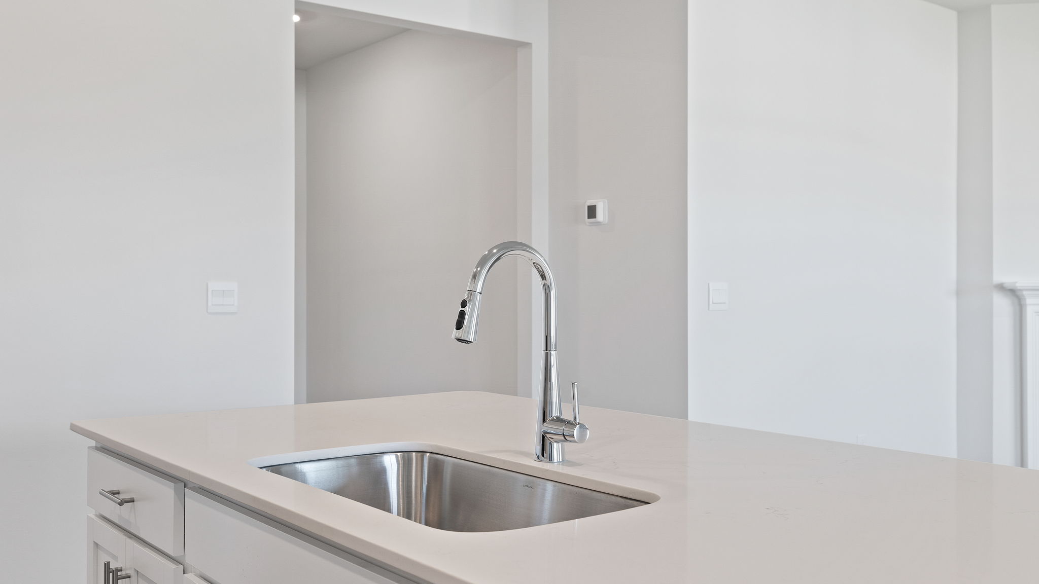 Kitchen and island with granite countertops.