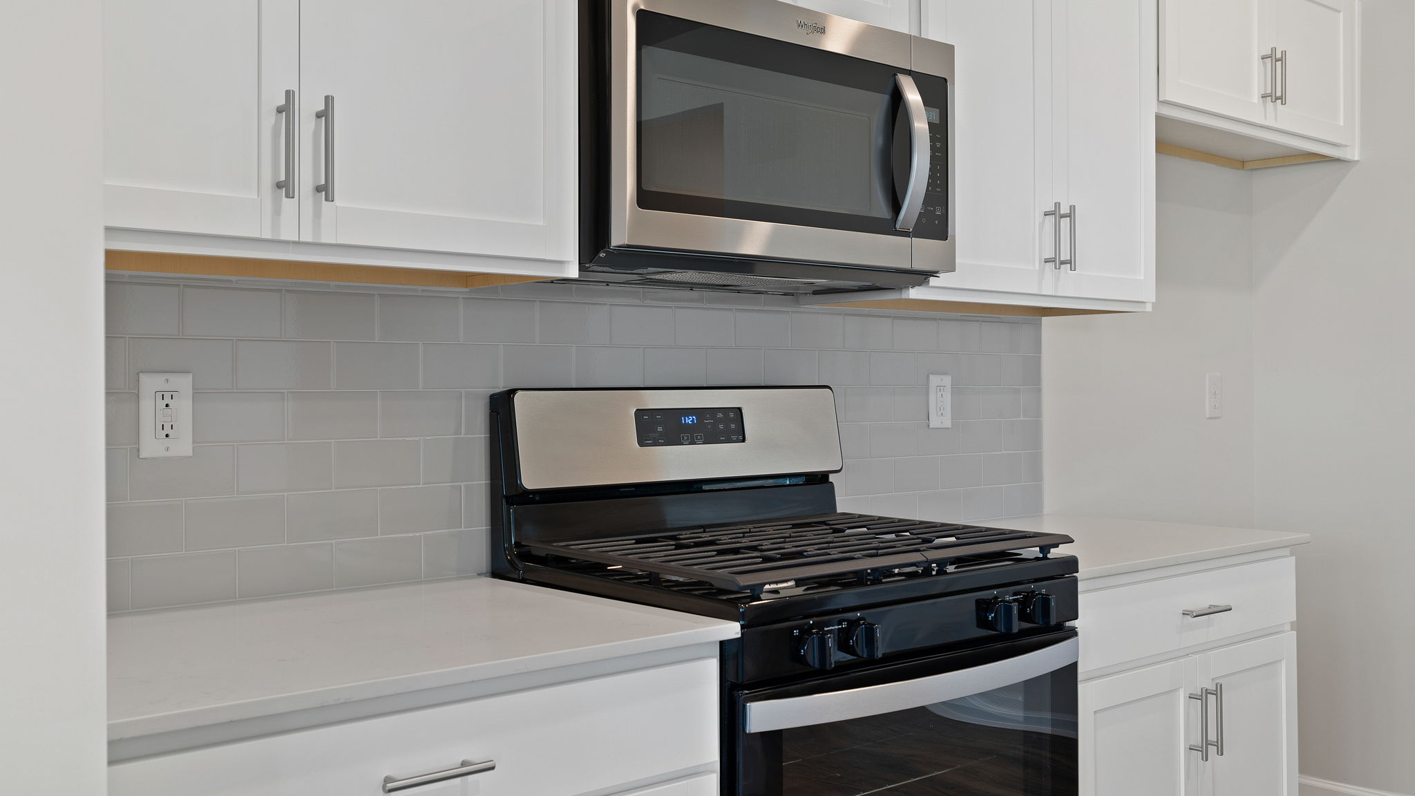 Kitchen with granite countertops and stainless steel appliances.