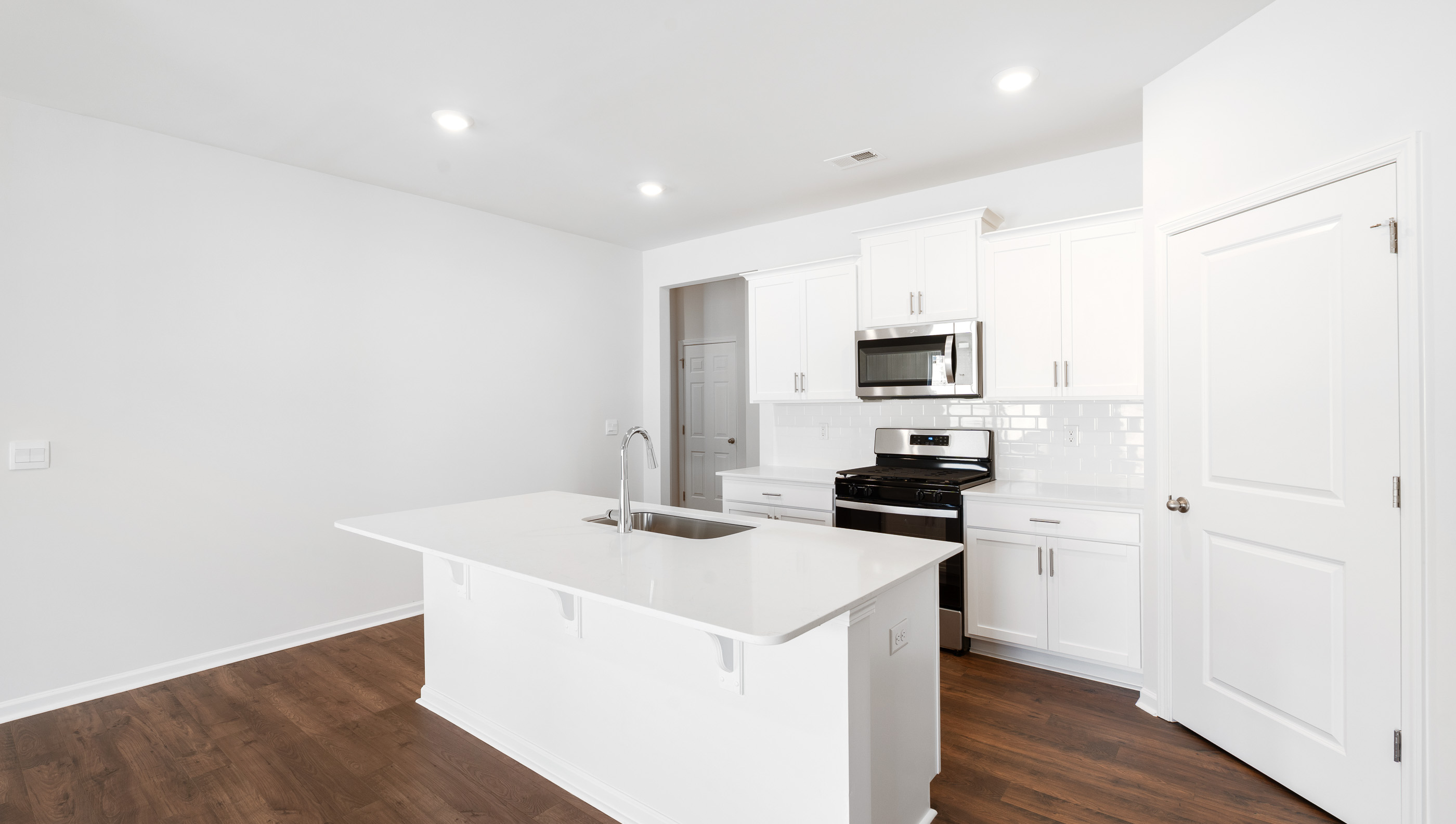 Kitchen with island and countertops.