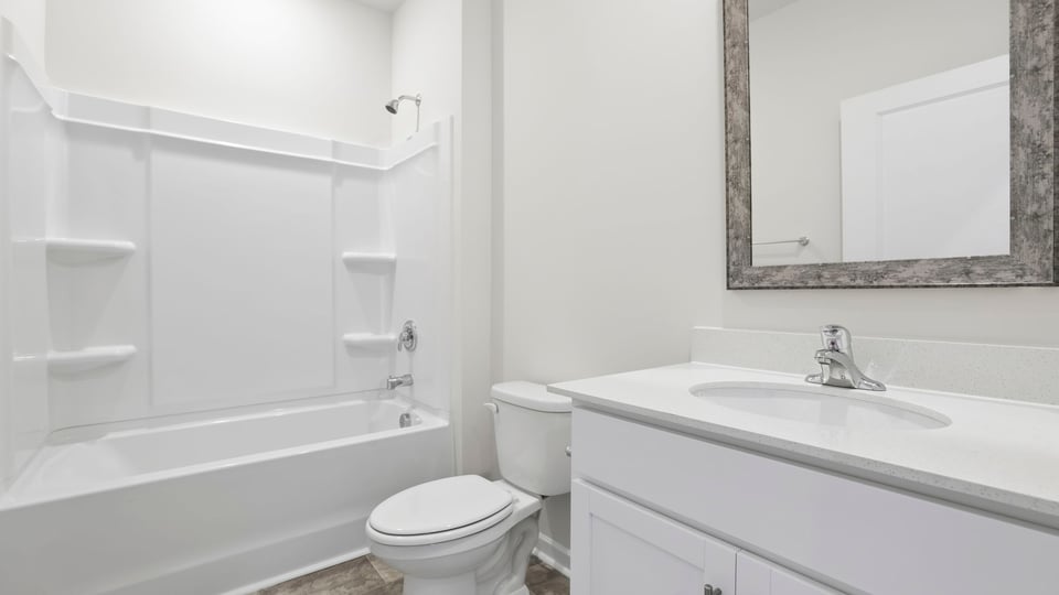 Bathroom with vanity and tub.