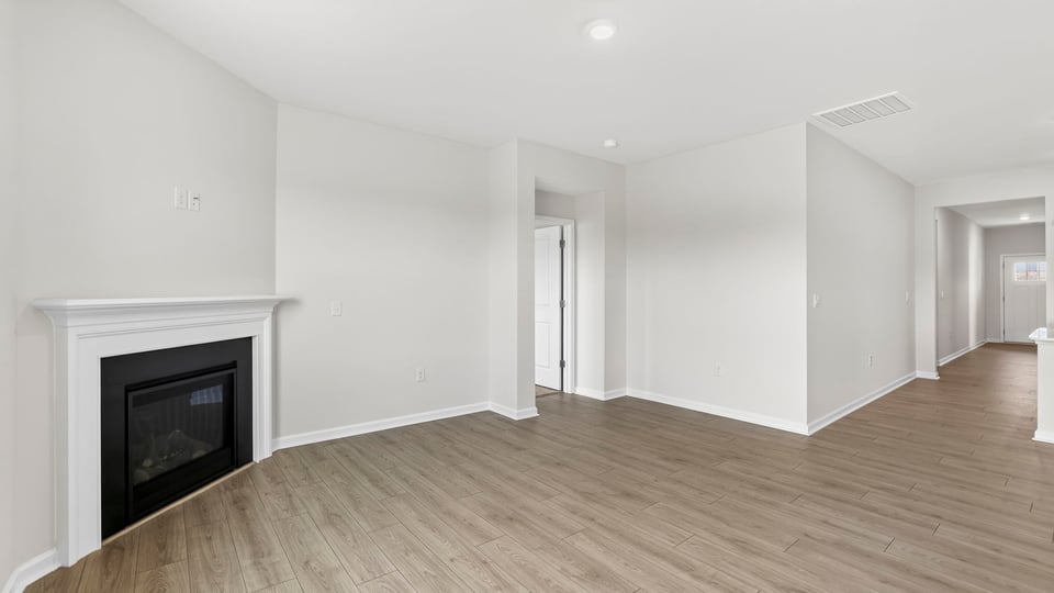 Livingroom with fireplace and window.