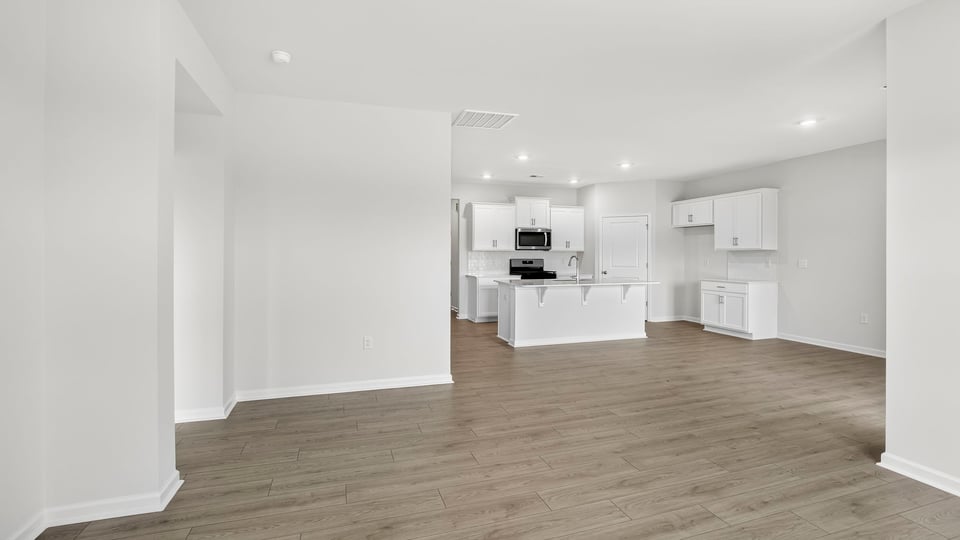 Livingroom with kitchen view.