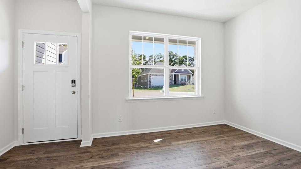 Dining room with window and door.