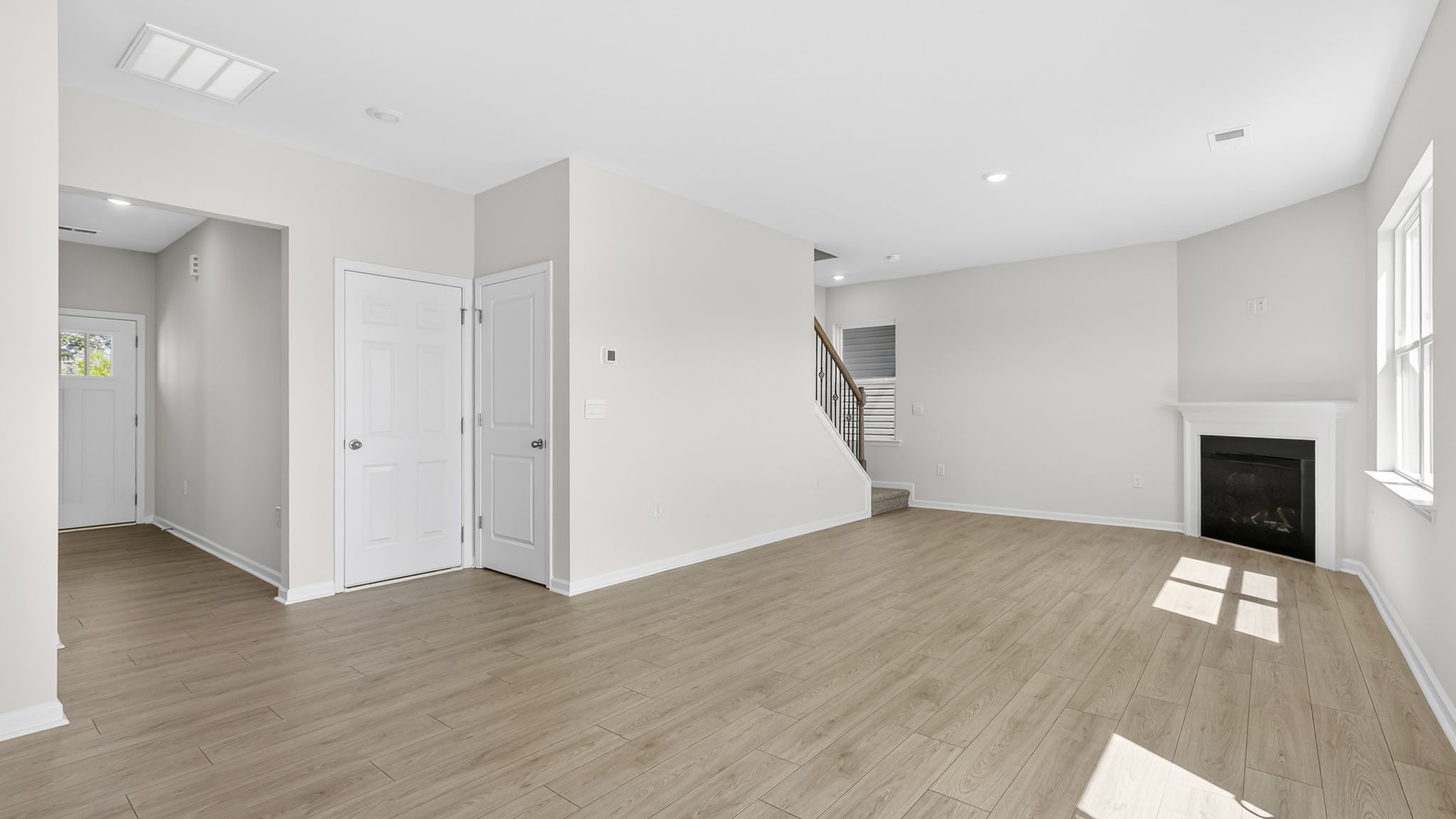 Family room with windows and fireplace.