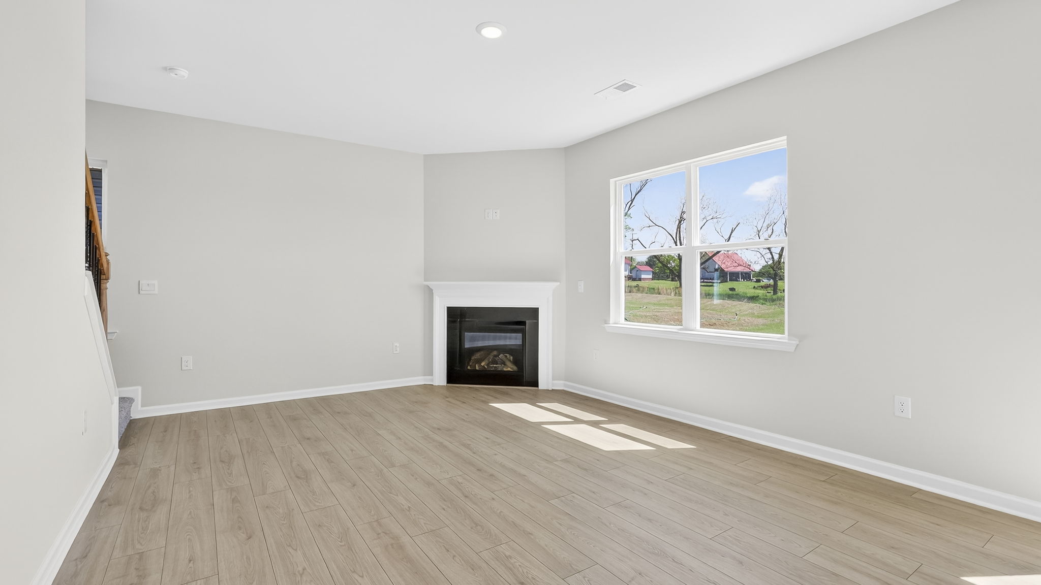 Family room with windows and fireplace.
