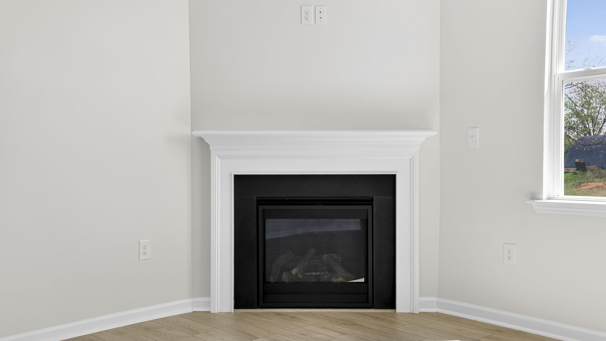 Family room with windows and fireplace.