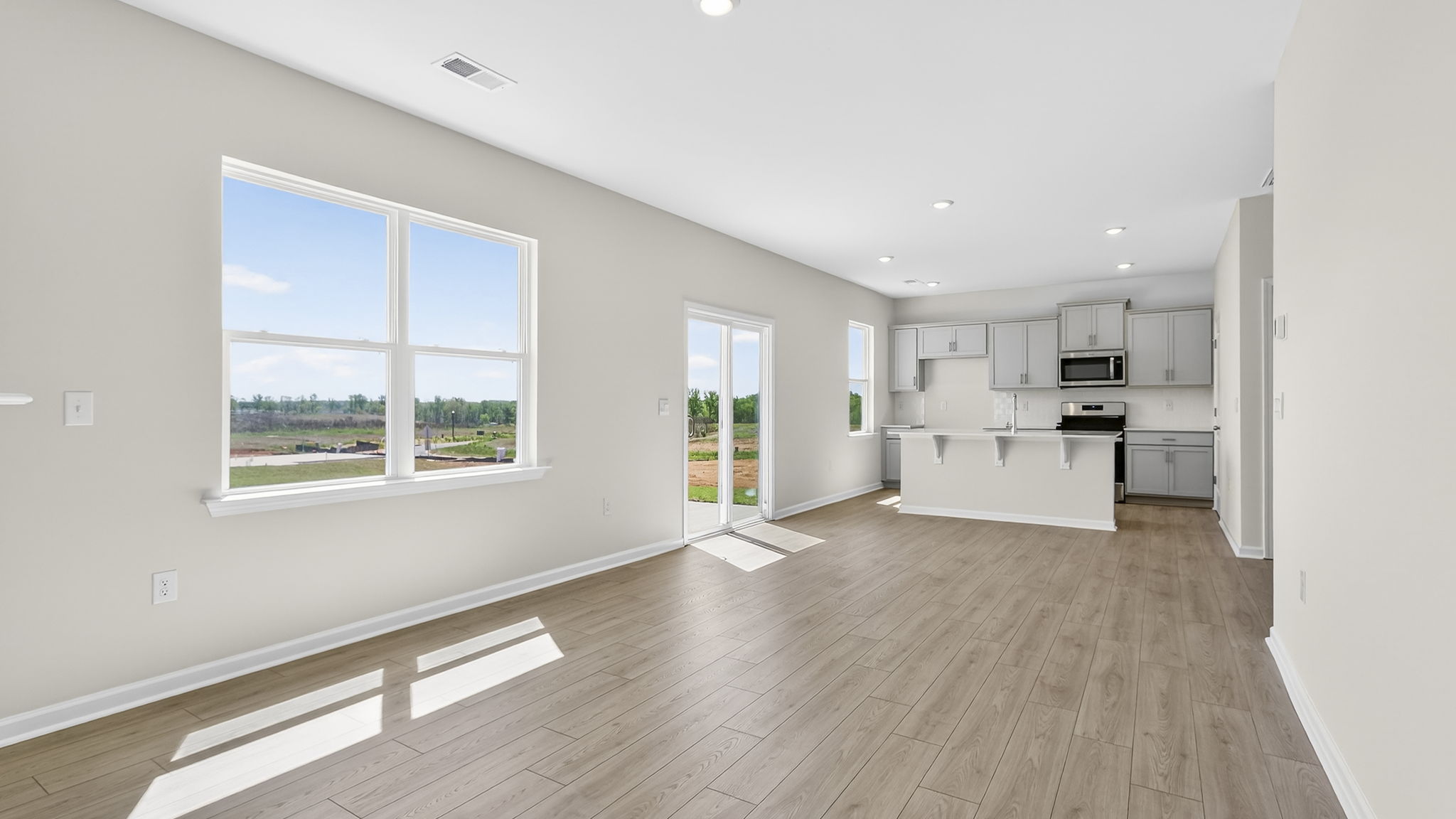 Family room with windows and fireplace.