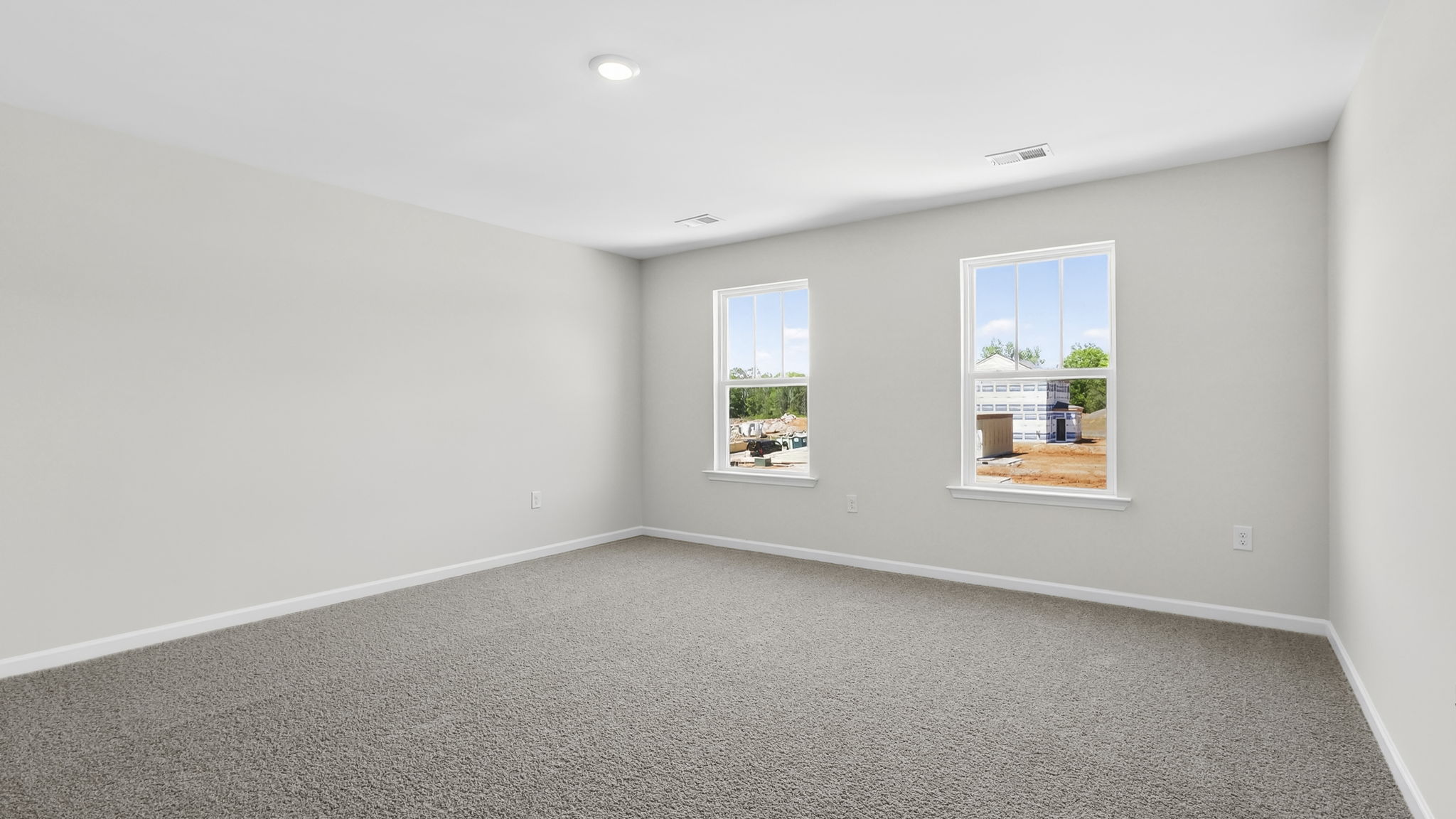 Bedroom with carpet and window.