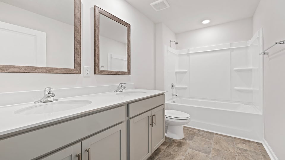 Bathroom with vanity and tub.