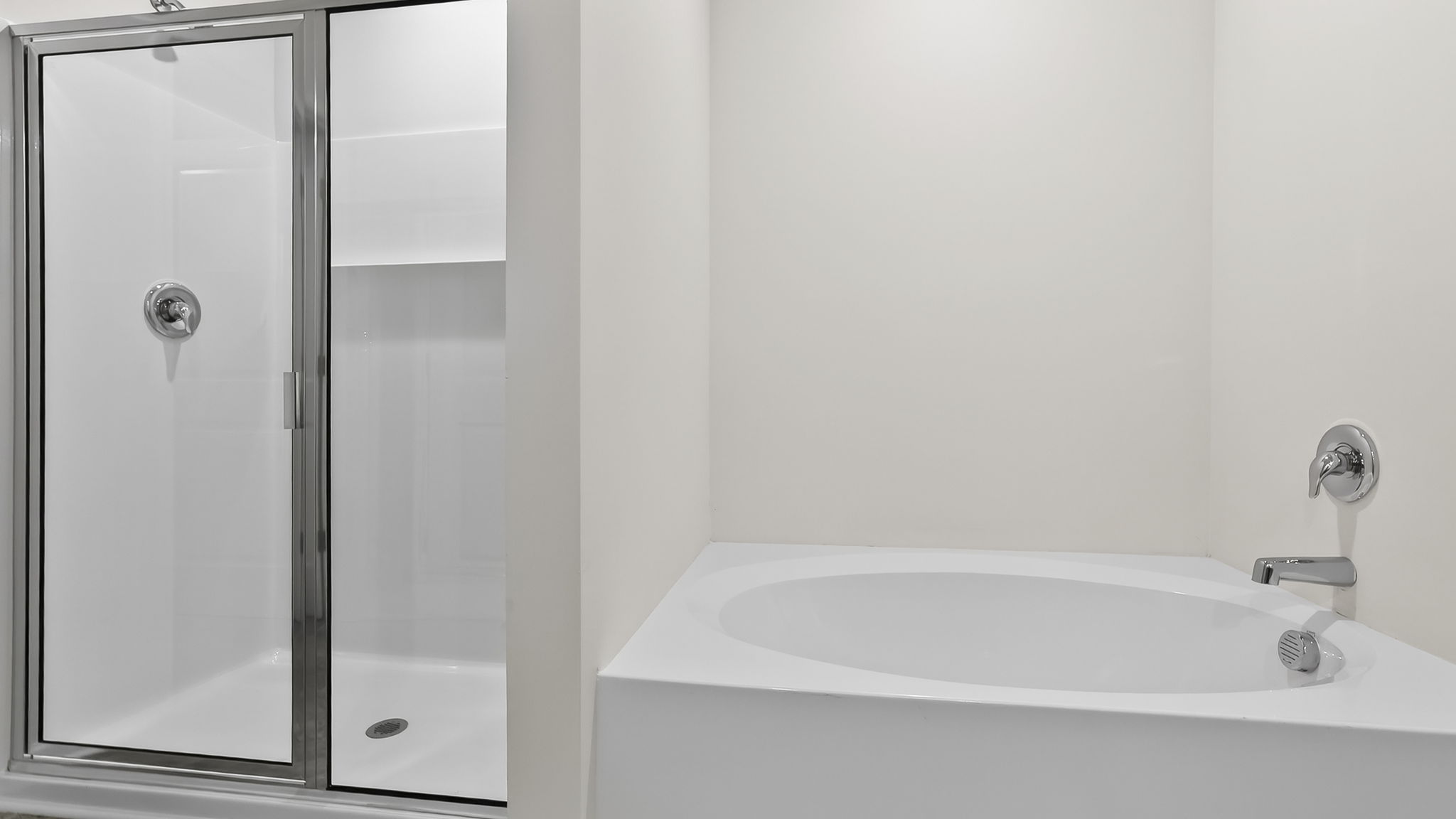 Bathroom with walk in shower and tub.