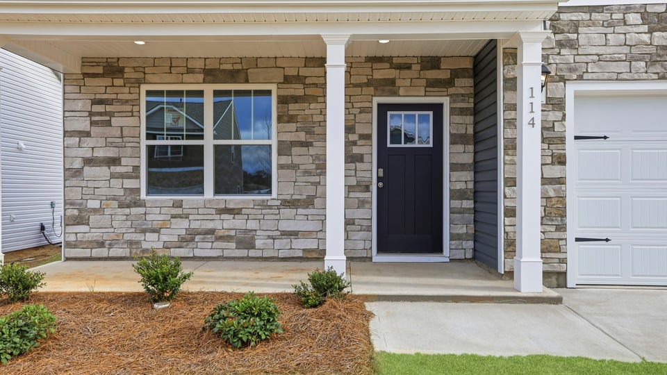 View of front door and garage.