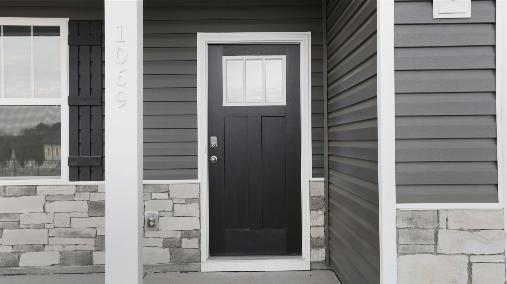 Front exterior of home with patio.
