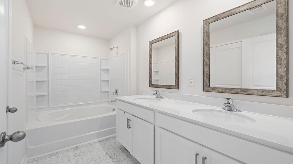 Bathroom with dual vanity.