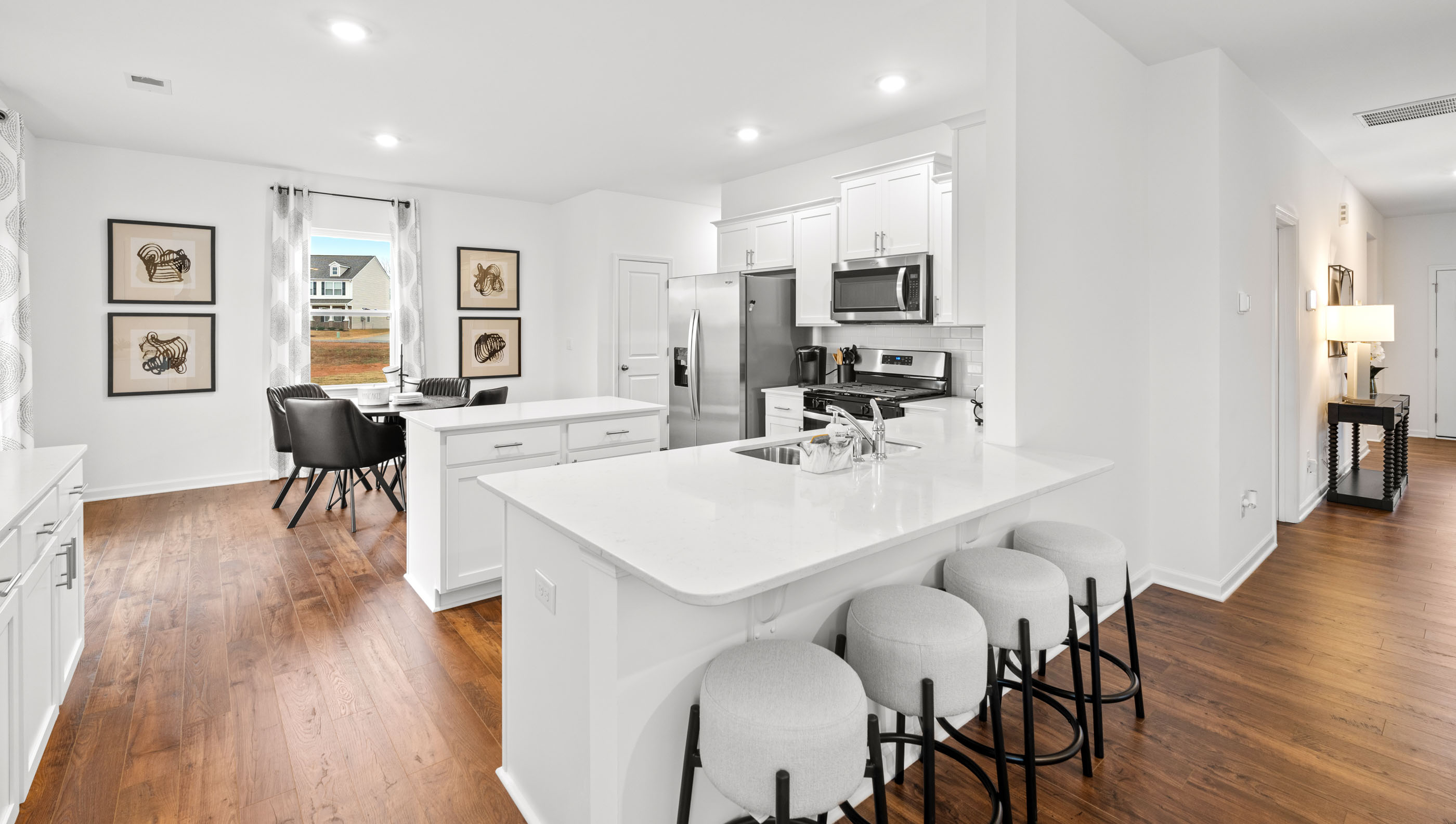 Kitchen with quartz countertops and stainless steel appliances.