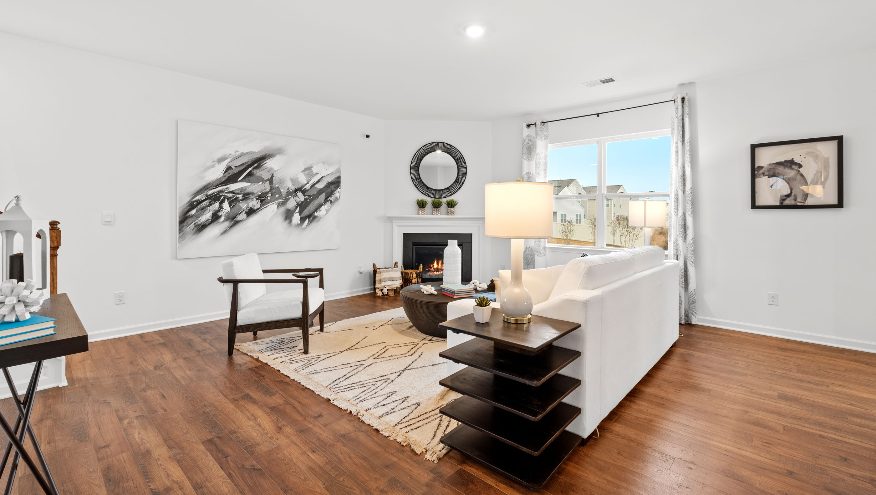 Living room with windows and fireplace.