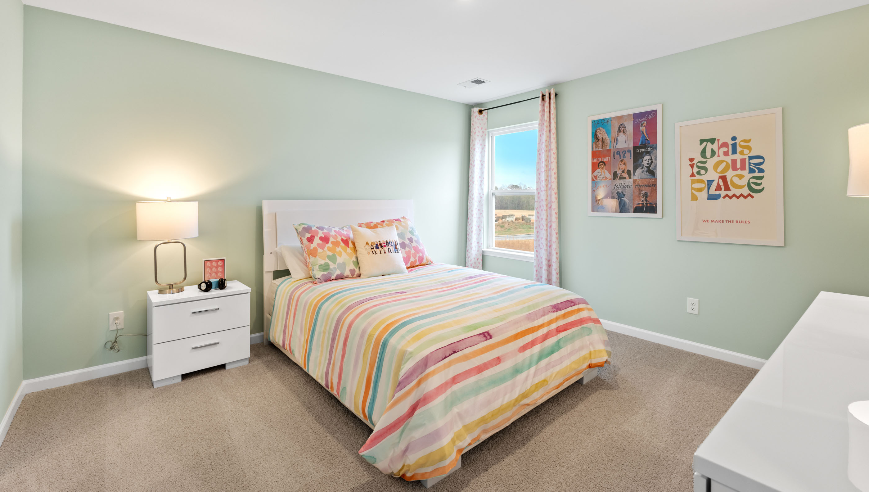 Bedroom with carpet and window.