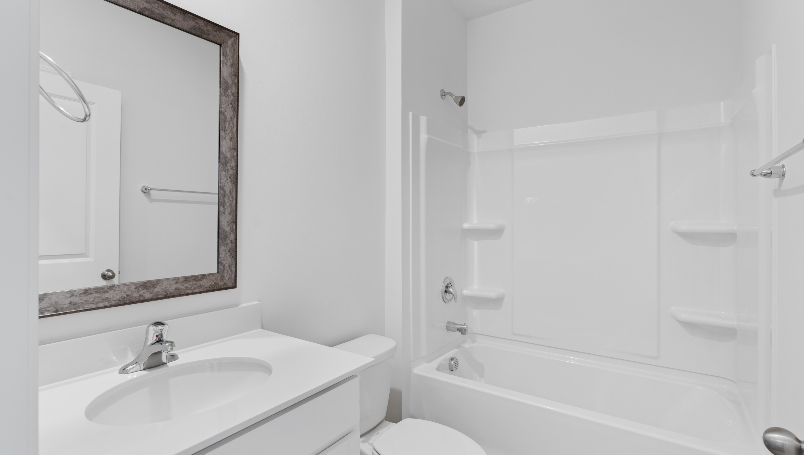 Bathroom with vanity and tub.