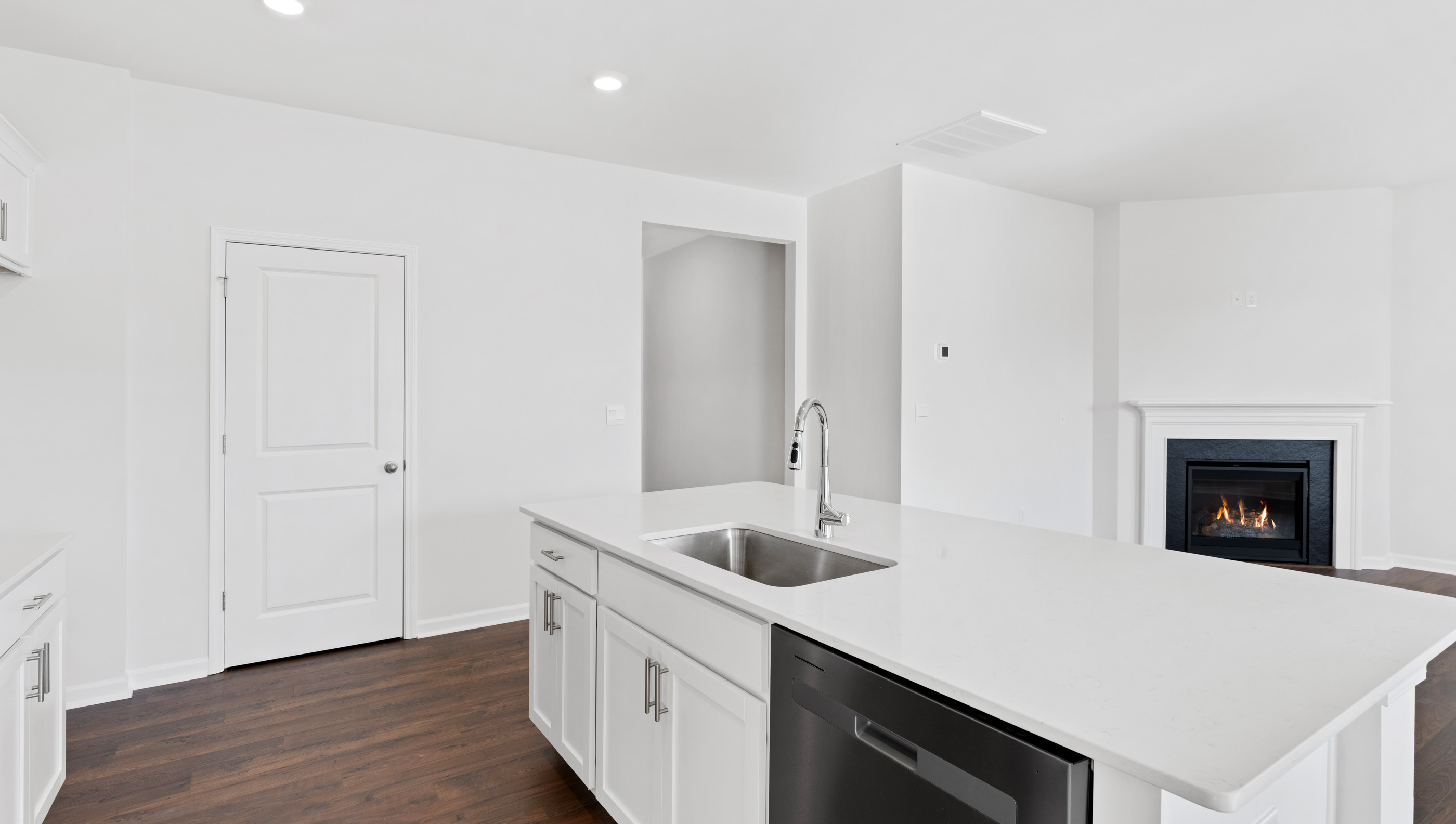 Kitchen and island with granite counter tops.