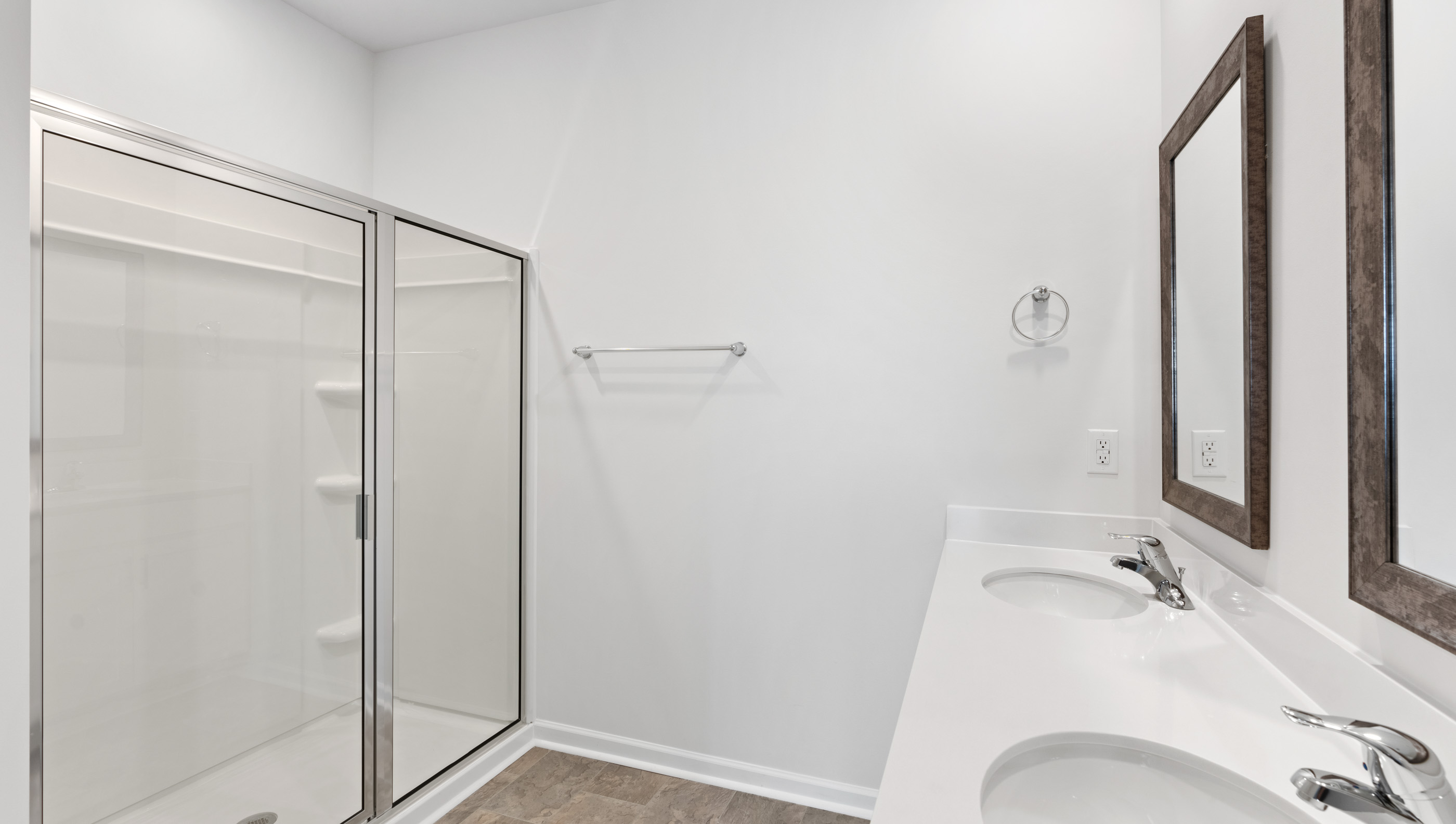 Double sink vanity and walk in closet.