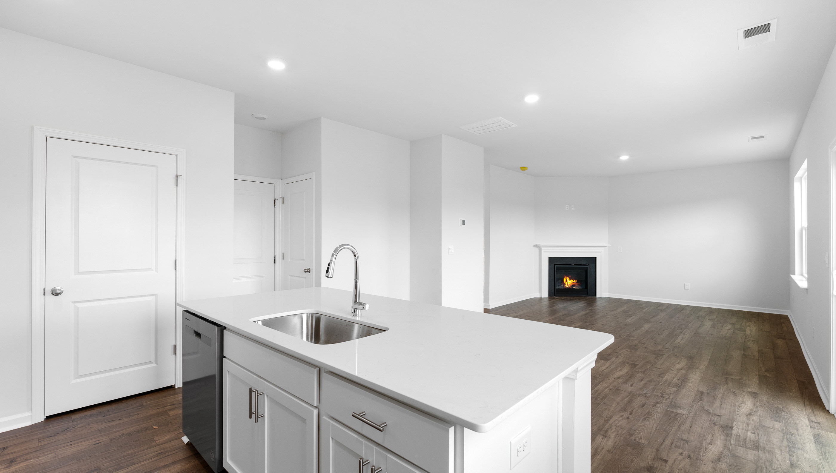 Kitchen and island with granite counter tops.