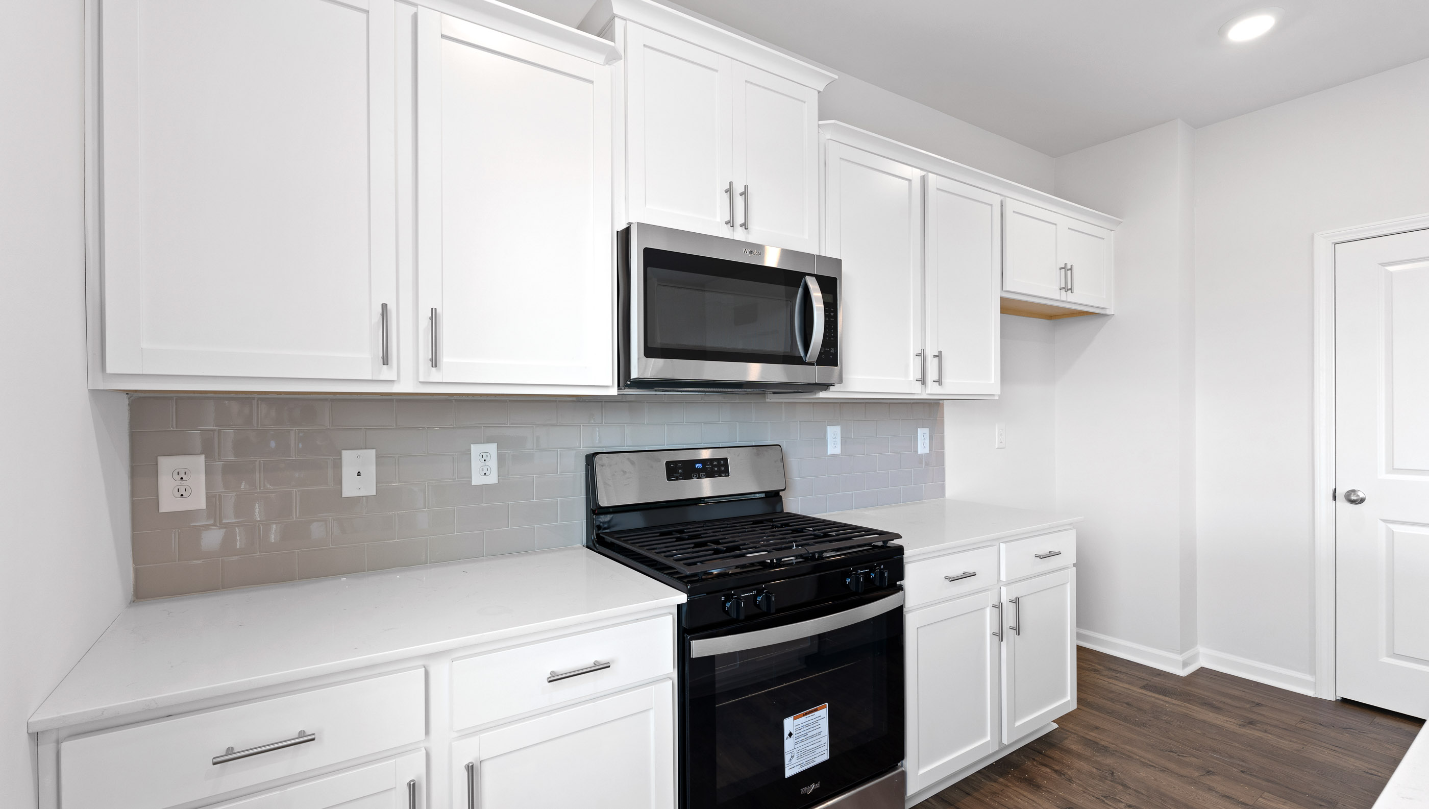 Kitchen and island with granite counter tops.