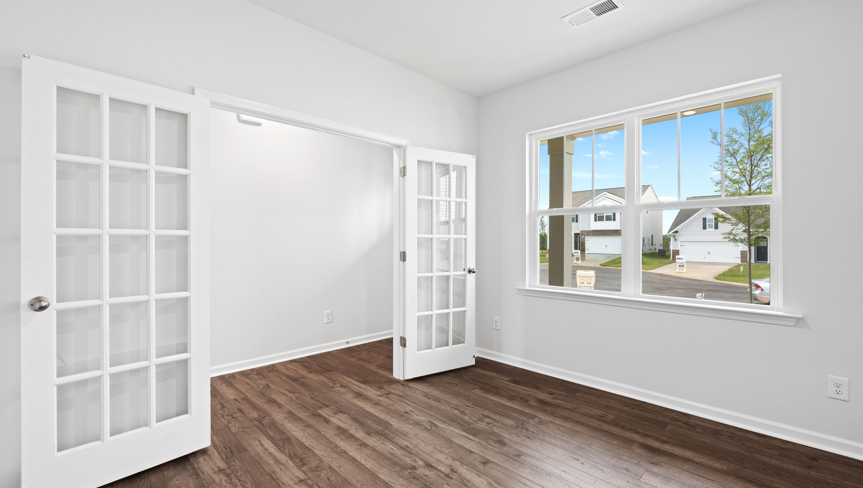 Flex room with window and french doors.