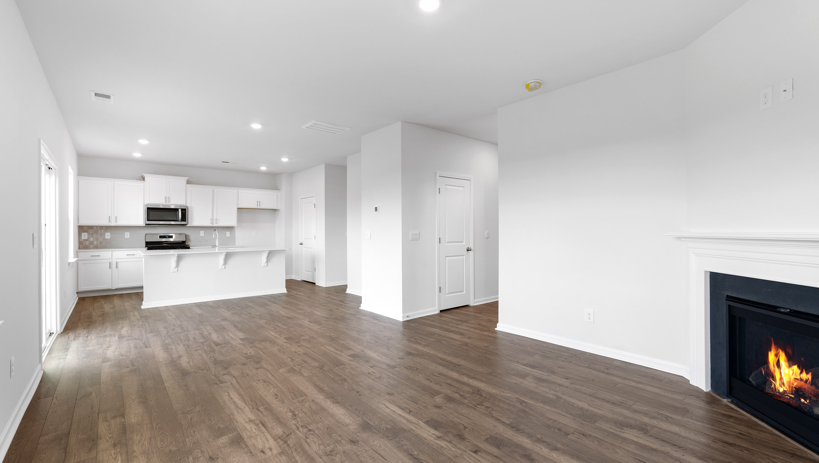 Living room with fireplace and window.