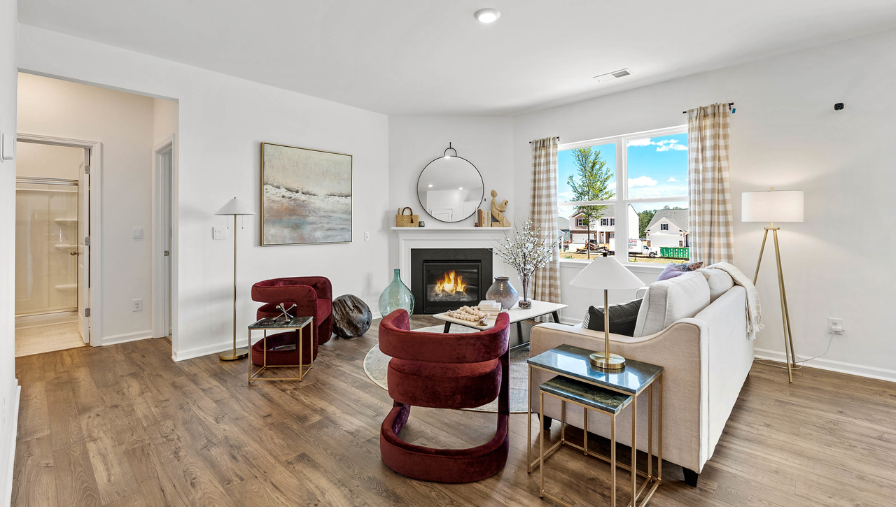 Living room with fireplace and window.