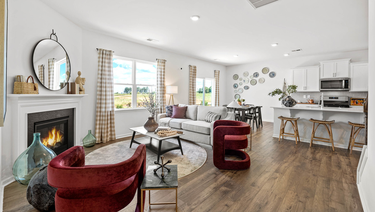 Living room with fireplace and window.