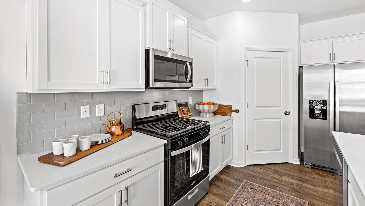 Kitchen and island with granite counter tops.