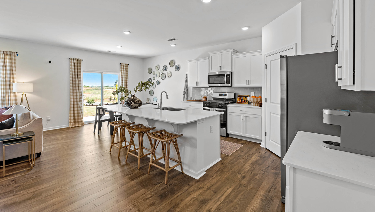 Kitchen and island with granite counter tops.