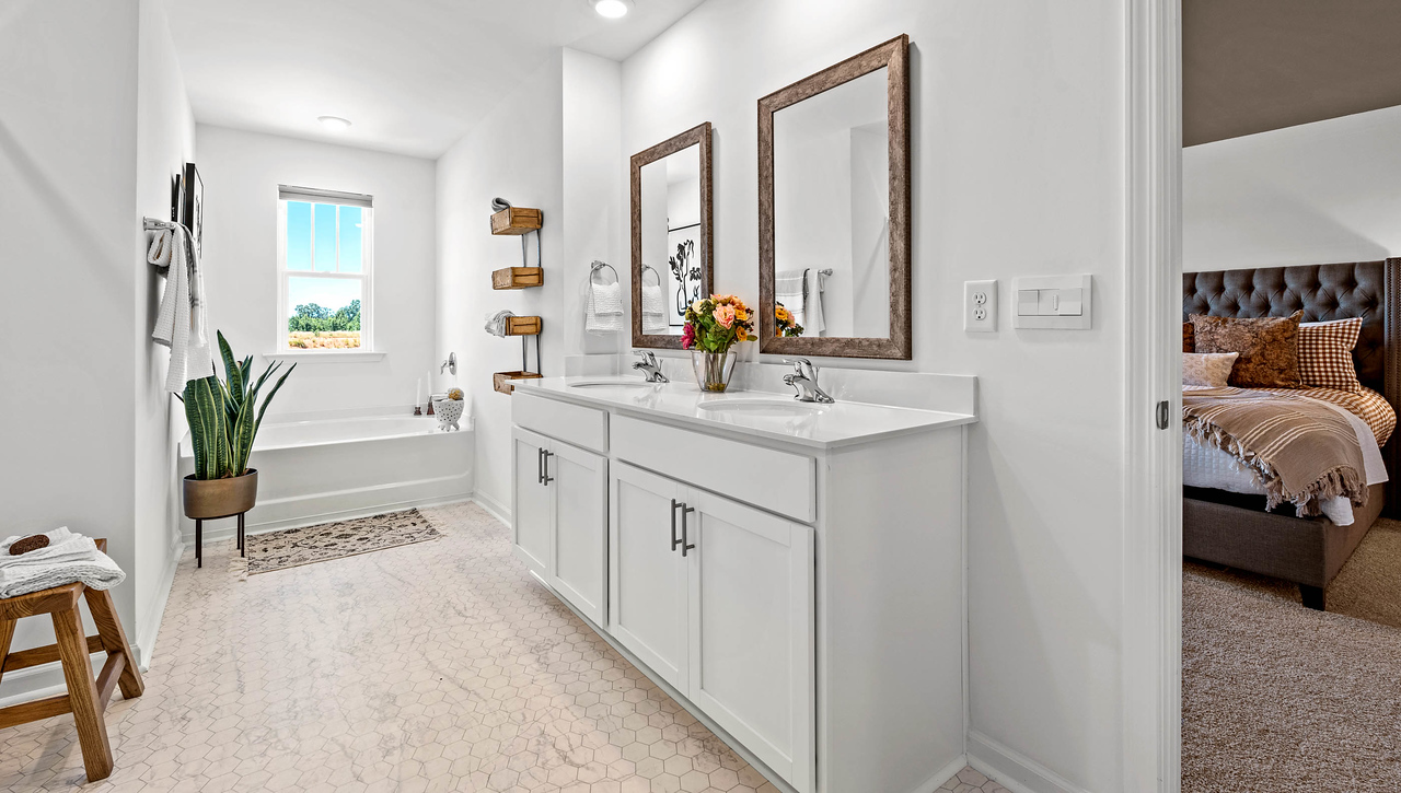 Double sink vanity in bathroom.
