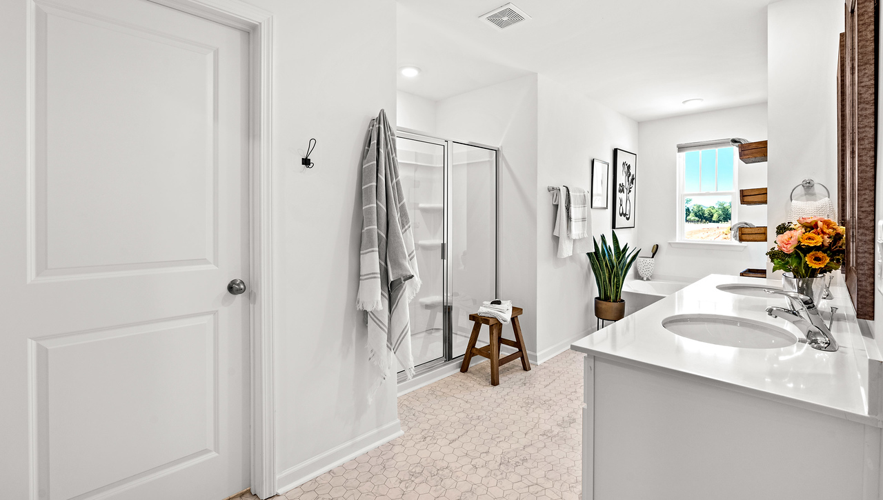 Double sink vanity in bathroom.