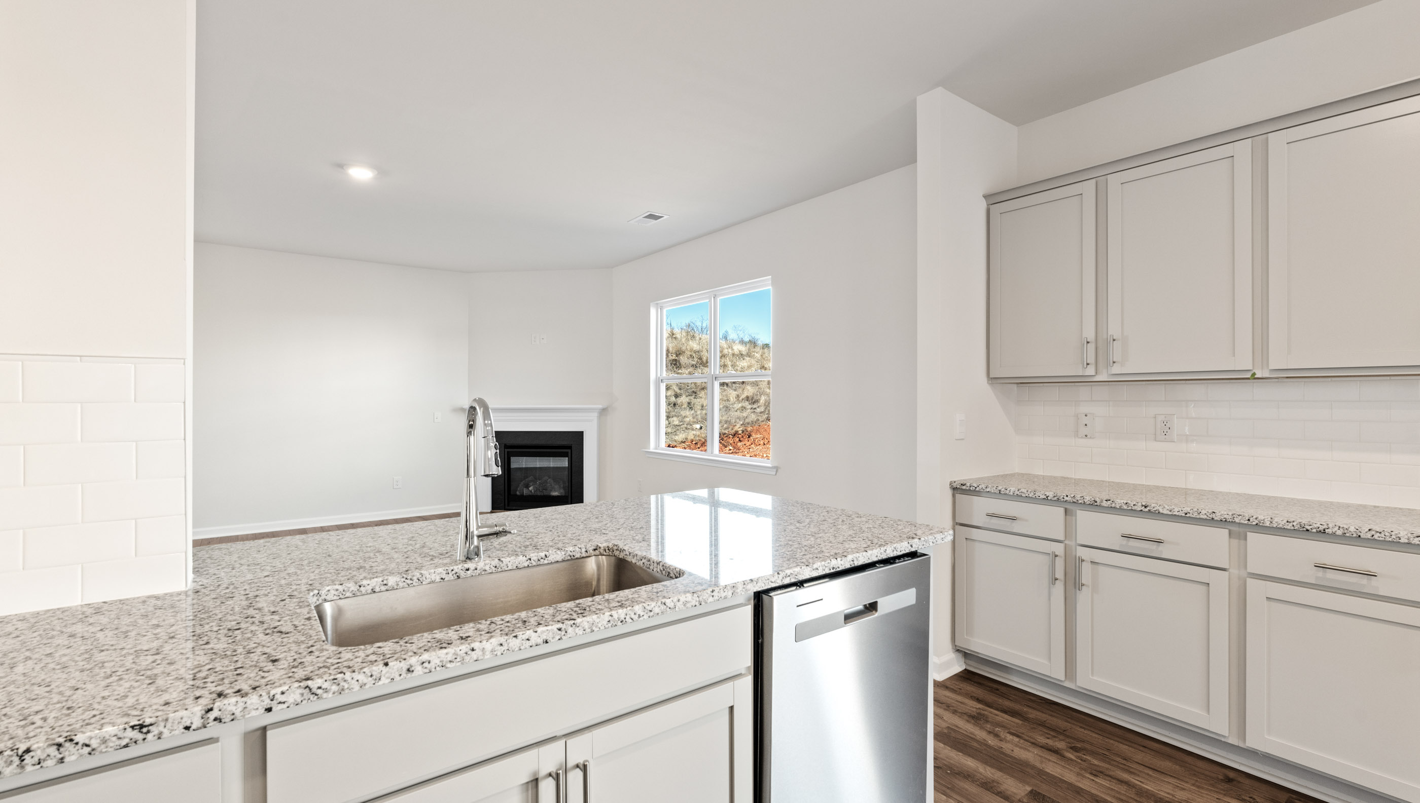 Kitchen and island with granite counter tops.