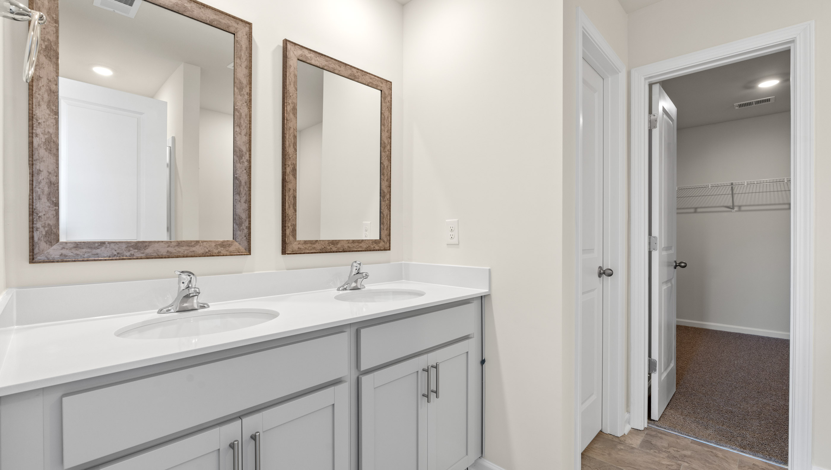 Double sink vanity in bathroom.