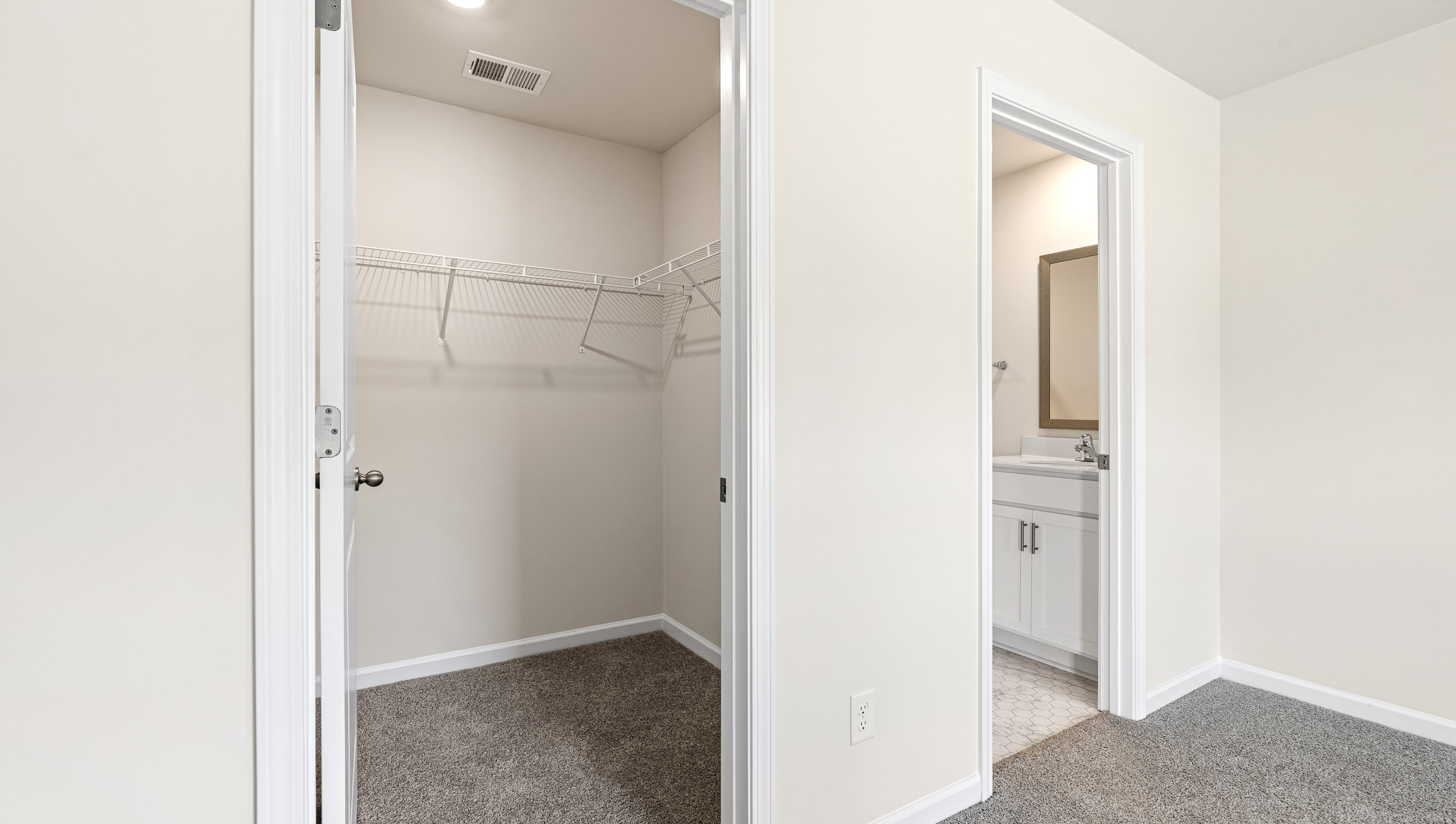Walk in closet with shelves.