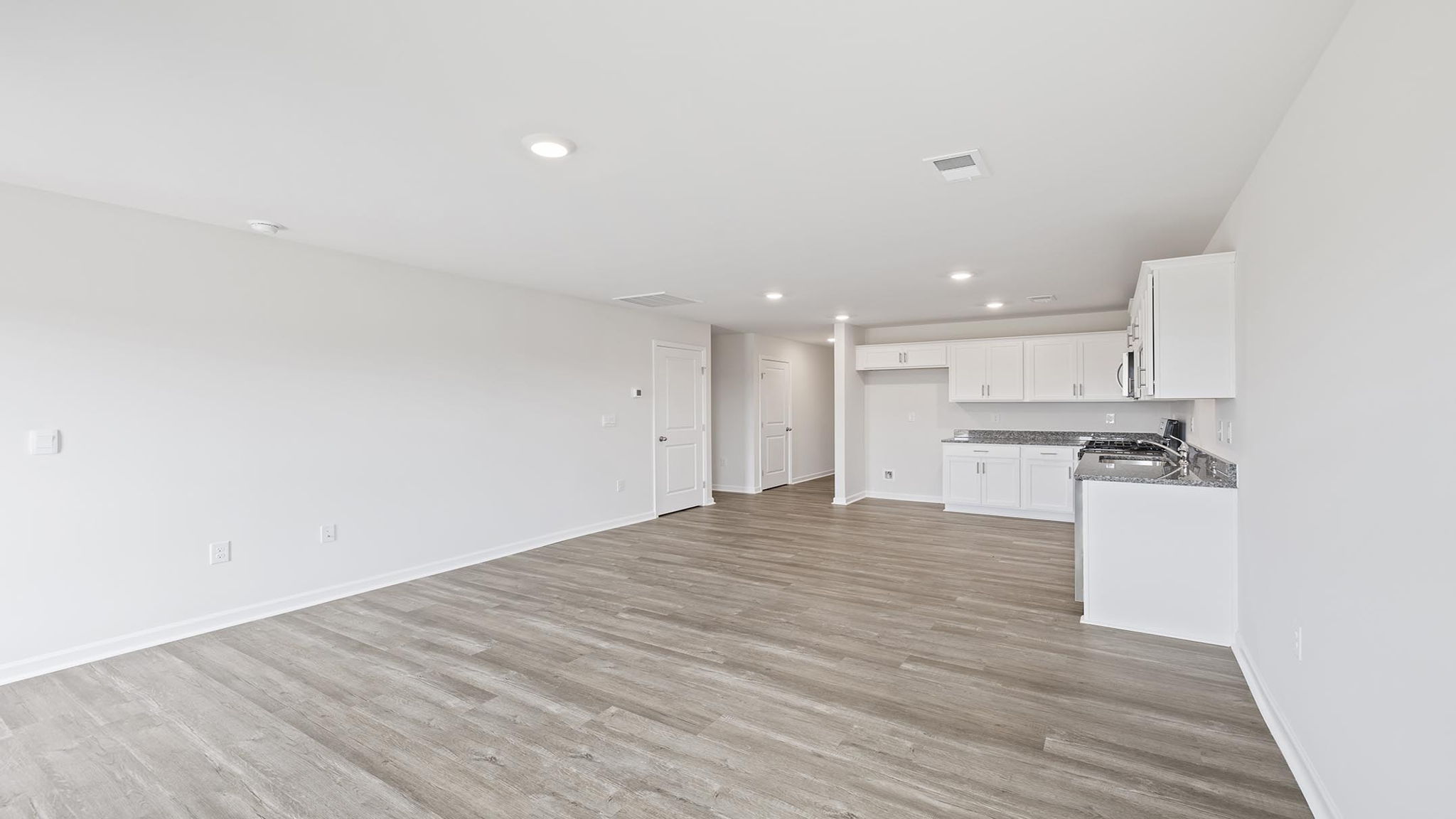Living room facing kitchen.