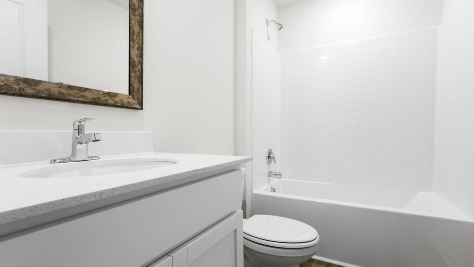 Bathroom with vanity and tub.