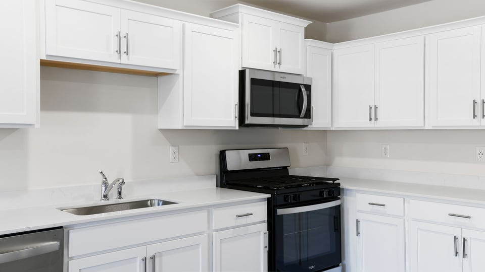 Kitchen with quartz countertops.