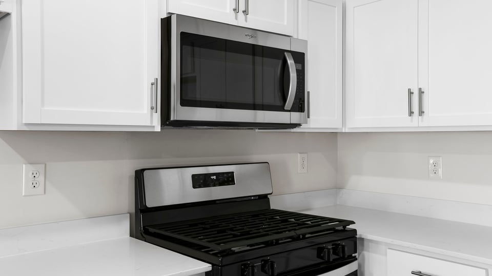 Kitchen with quartz countertops.