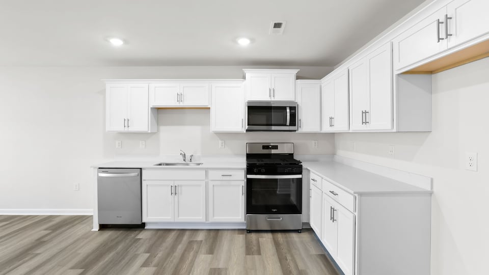 Kitchen with quartz countertops.