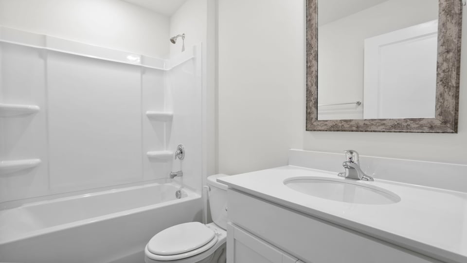 Bathroom with vanity and tub.