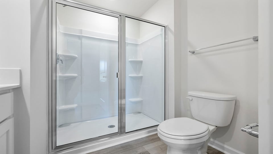 Bathroom with vanity and shower.