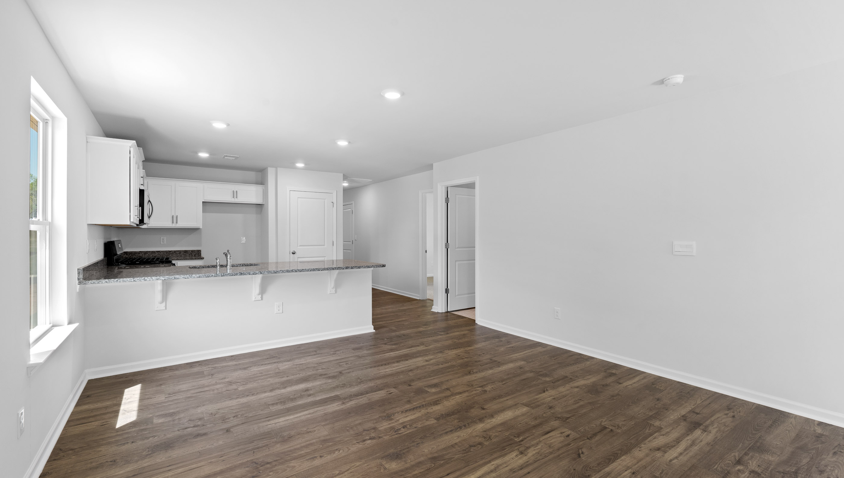 Kitchen with granite counter tops and stainless steel appliances.