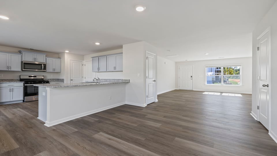 Kitchen and dining room with windows.